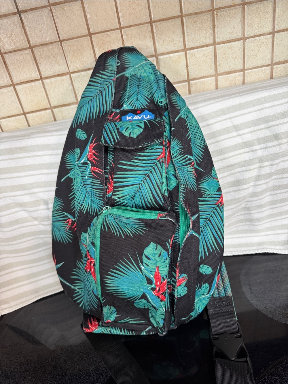 Kavu Black Sling Bag with Teal Leaf Print and Red Accents